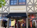 View on facade with logo lettering of Burberry fashion company at shop entrance