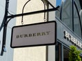 View on facade with logo lettering of Burberry fashion company at shop entrance