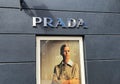 View on facade with logo lettering of Prada fashion company at shop entrance