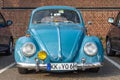 Front view of an old blue Volkswagen beetle in excellent condition