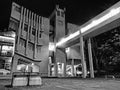 The Roger Stevens building a 1960s concrete brutalist building taken at night with flare from lights and illuminated walkway Royalty Free Stock Photo