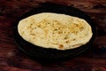 Roghni naan, khamiri roti, kulcha, bread, or chappati served in a dish isolated on background top view