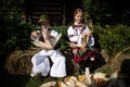 Rogoz, Romania, October 12th, 2019, Kids wearing traditional separates corn from chaff - disjoca