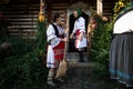 Rogoz, Romania, October 12th, 2019, Women wearing traditional in Maramures cleaning in front of the house