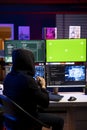 Rogue technician uses AI on green screen PC to develop zero day exploit Royalty Free Stock Photo