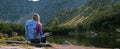 Rohacske lake in Slovakia. Western Tatras mountains, Rohace Slovakia. Woman hiker with backpack rises to the mountains. Discovery Royalty Free Stock Photo