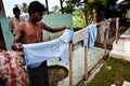 A Rohingya refugee was hanging clothes in a refugee camp. Royalty Free Stock Photo