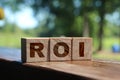 ROI. Wooden cubes with letters ROI. Return on investment business concept Royalty Free Stock Photo