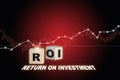 ROI written on wooden cubes and growth graph on red background