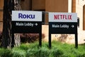 Roku and Netflix informational signs directing visitors to the main lobby of the famous media companies
