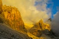 Dolomites rocky mountain wall at sunset yellow light Royalty Free Stock Photo