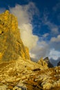 Roky cliff mountains of Dolomites yellow color at sunset