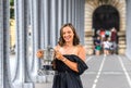 2023 Roland Garros Champion Iga Swiatek of Poland posing with The Suzanne-Lenglen Cup under the Pont de Bir-Hakeim