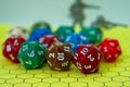 Role-playing board with several colored dice and plastic figures Royalty Free Stock Photo