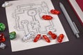 Roleplaying game dices on hand drawn dungeon adventure map. Concept for table top role playing games