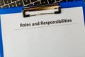 Roles and responsibilities document in the tablet at the laptop on the table. Royalty Free Stock Photo