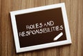 Roles And Responsibilities. Hand writing with copyspace for text. Nice texture Royalty Free Stock Photo