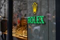 Rolex, famous Suisse watch brand outdoor shield or sign on shopping window of boutique in Zurich.
