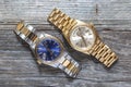 Rolex Oyster Perpetual Day- Date and Oyster Blue watch on wooden background