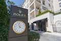 TIVAT, MONTENEGRO - JULY 15, 2021: Rolex signboard stand with a large watch in a luxury residential area in Porto