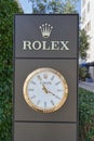 TIVAT, MONTENEGRO - JULY 15, 2021: Rolex signboard stand with a large watch in a Porto Montenegro