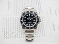 Rolex submariner on English paper