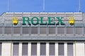 Rolex watch brandname and business icon as marquee on building exterior