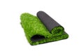 Roll of artificial green grass isolated on white background, covering for playgrounds and sports grounds
