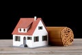 A roll of bamboo slips and a house model on the table Royalty Free Stock Photo