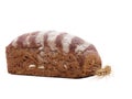Bun of black bread next to wheat ear on white isolated background Royalty Free Stock Photo