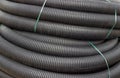 Roll of black flexible conduit nylon pipe background