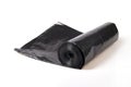 Roll of black plastic polyethylene sheeting isolated on white Royalty Free Stock Photo