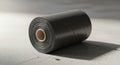 Roll of Black Plastic Sheeting on Concrete Surface, Industrial Material Royalty Free Stock Photo
