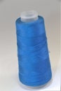 Roll of blue sewing thread Royalty Free Stock Photo