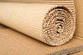 Roll of brown corrugated cardboard, closeup. Royalty Free Stock Photo