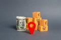 Roll bundle of dollars, red pointer location and cardboard boxes. Global market and business, import and export of goods Royalty Free Stock Photo