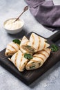 Roll with cheese and herbs. Grilled pita bread with filling. Cucumber radish salad. The concept of a healthy Breakfast Royalty Free Stock Photo