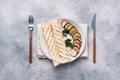 Roll with cheese and herbs. Grilled pita bread with filling. Cucumber radish salad. The concept of a healthy Breakfast. Copy space Royalty Free Stock Photo