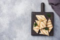 Roll with cheese and herbs. Grilled pita bread with filling. Cucumber radish salad. The concept of a healthy Breakfast. Copy space Royalty Free Stock Photo