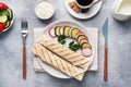 Roll with cheese and herbs. Grilled pita bread with filling. Cucumber radish salad. The concept of a healthy Breakfast. Cup of Royalty Free Stock Photo