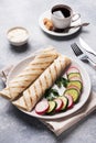 Roll with cheese and herbs. Grilled pita bread with filling. Cucumber radish salad. The concept of a healthy Breakfast. Cup of Royalty Free Stock Photo