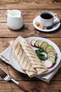 Roll with cheese and herbs. Grilled pita bread with filling. Cucumber radish salad. The concept of a healthy Breakfast. Cup of Royalty Free Stock Photo