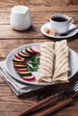 Roll with cheese and herbs. Grilled pita bread with filling. Cucumber radish salad. The concept of a healthy Breakfast Royalty Free Stock Photo