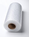 Roll of Clear Bubble Wrap Packaging Material on White Background Royalty Free Stock Photo