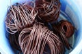 The roll of copper wire in plastic bowl Royalty Free Stock Photo