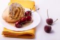 Roll with cream and cherries. Summer dessert with berries Royalty Free Stock Photo