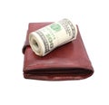 Roll of dollars on old leather purse Royalty Free Stock Photo