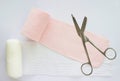 Roll elastic bandage or gauze with scissors