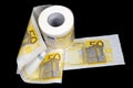 Roll of 50 Euro bank notes toilet paper isolated on black background