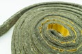 A roll of felt insulation. Self-adhesive tape with felt insulation for entrance doors. Goods for repair. Selective focus